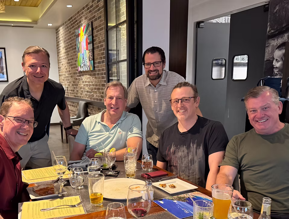 Phello members sharing a meal together at a regional dinner